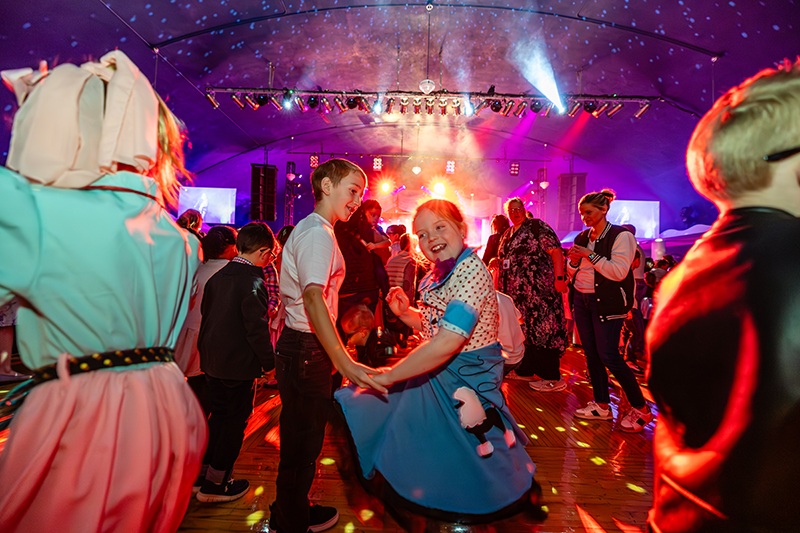 Kids dancing at the Rockin' Kids Show 2025