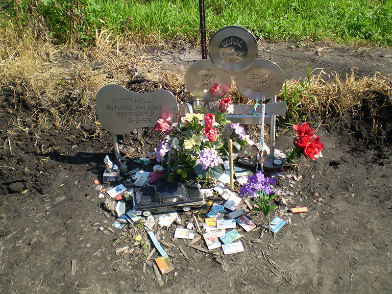 A shot of the entire memorial with flowers and mementos left by fans and mourners.